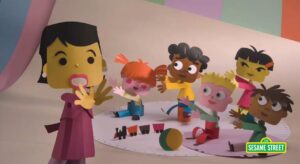 Photo of Animated Paper Teacher and 5 kids on a rug with toys