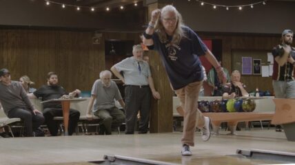Senior trans woman bowling