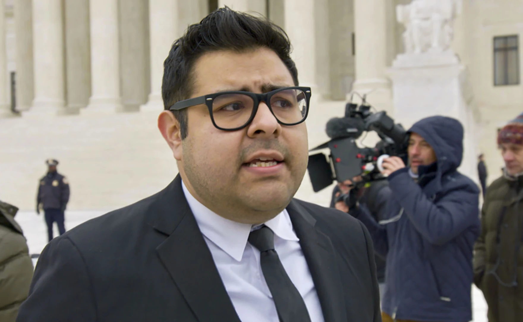 Luis shown in front of the courthouse