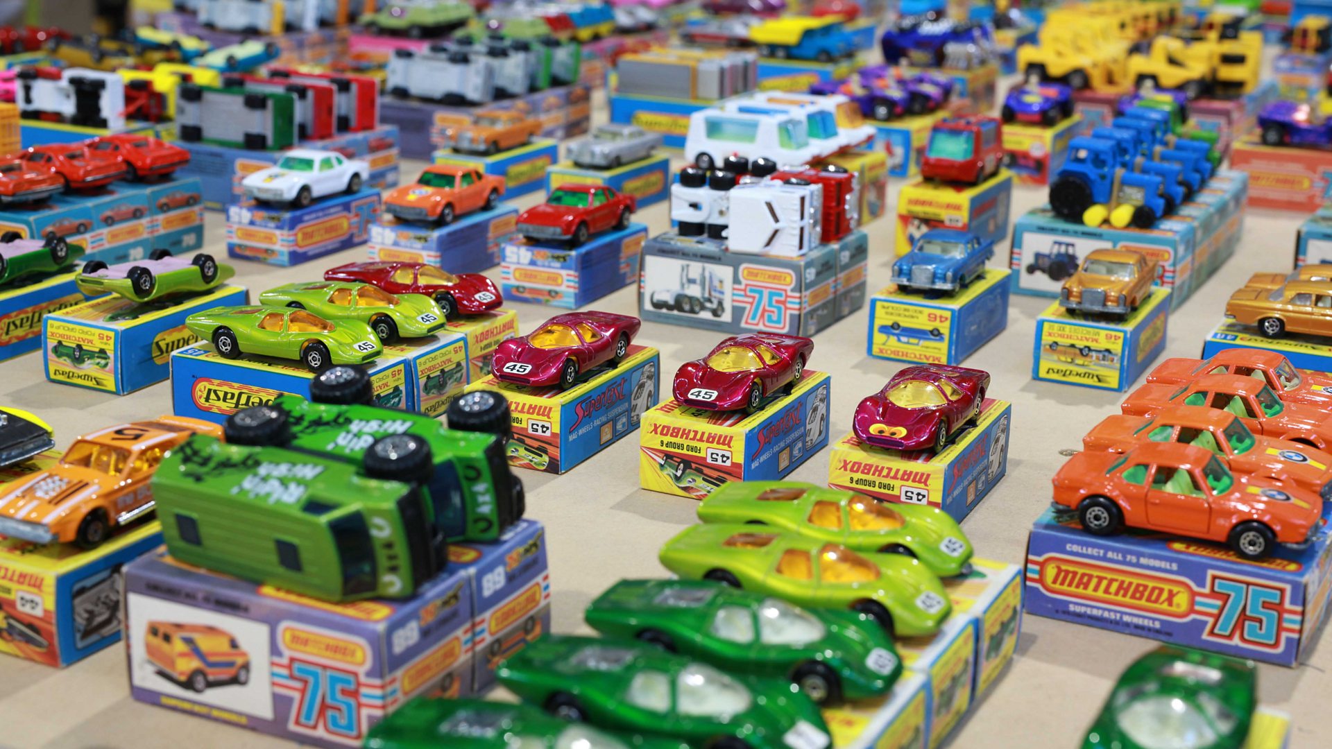 A sea of collectible match cars that sit on top of their original packing boxes