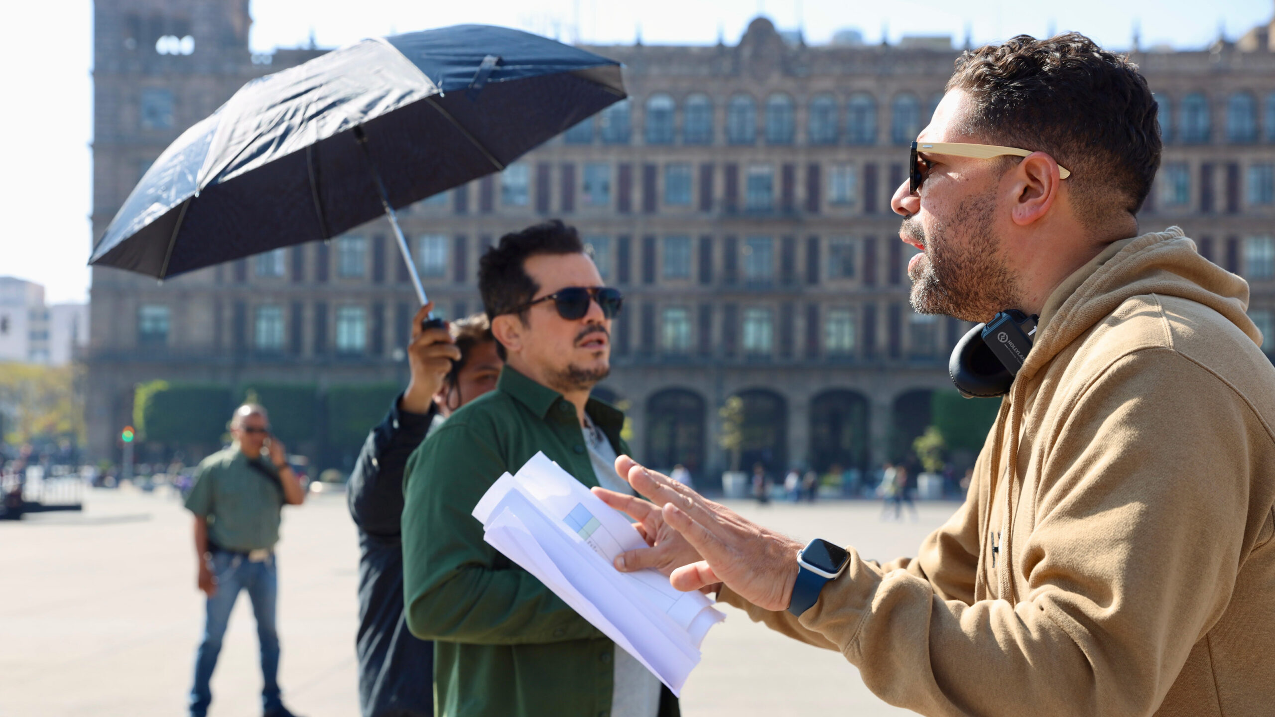 Director Ben DeJesus and host John Leguizamo on the set