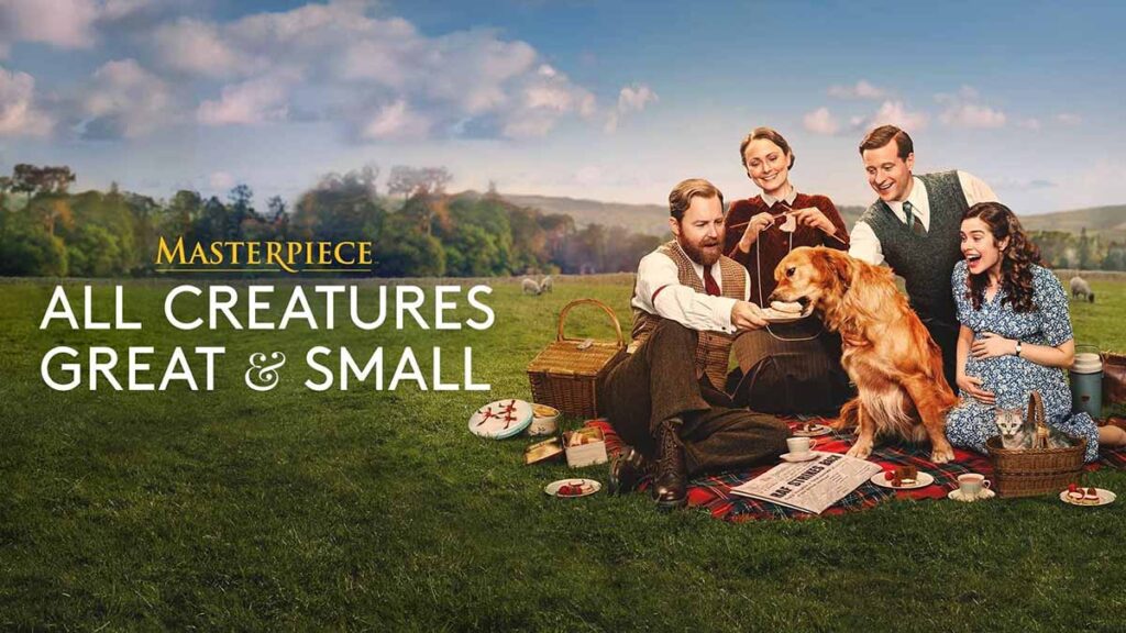 The cast of All Creatures Great and Small enjoy a picnic outside together on a grassy field